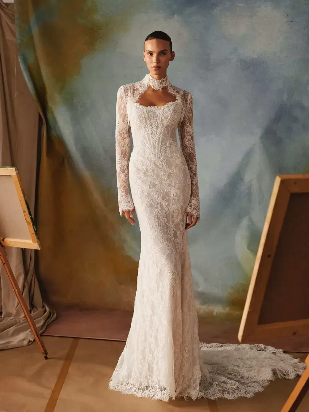 model is wearing a strapless lace bridal gown with detachable long sleeves